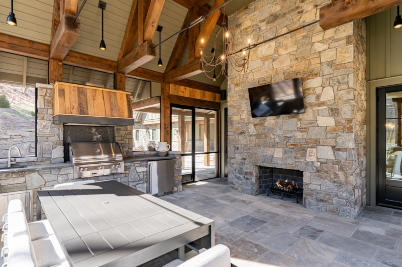Covered Patio Rustic Stone Fireplace with Vaulted Wood Ceiling