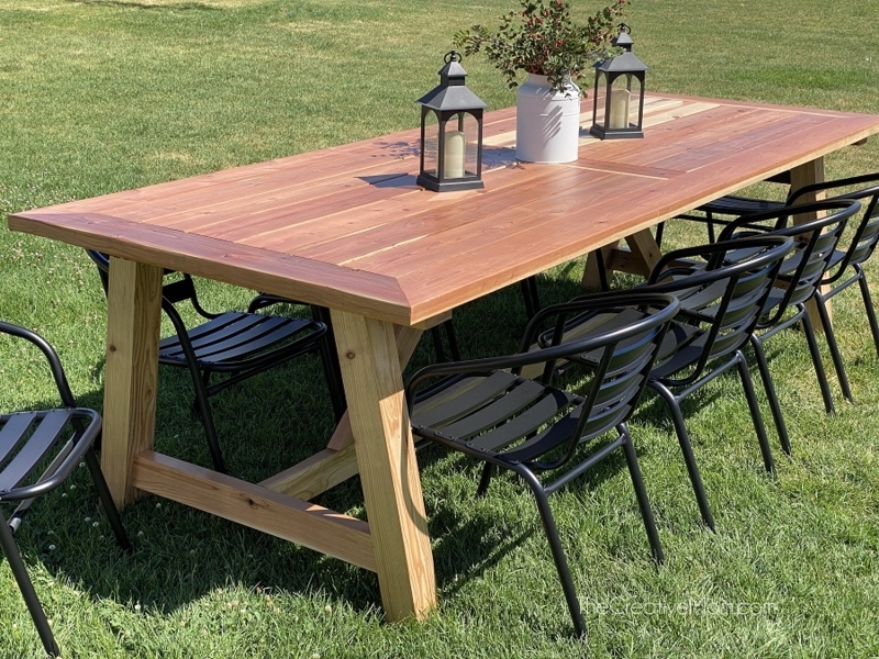 Dining Table with Reddish-Brown Top and Rustic Two-Tone Timber Base