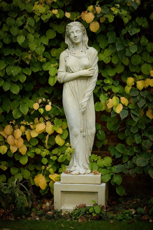 Draped Outdoor Statue on Rectangular Pedestal for Winter Theme
