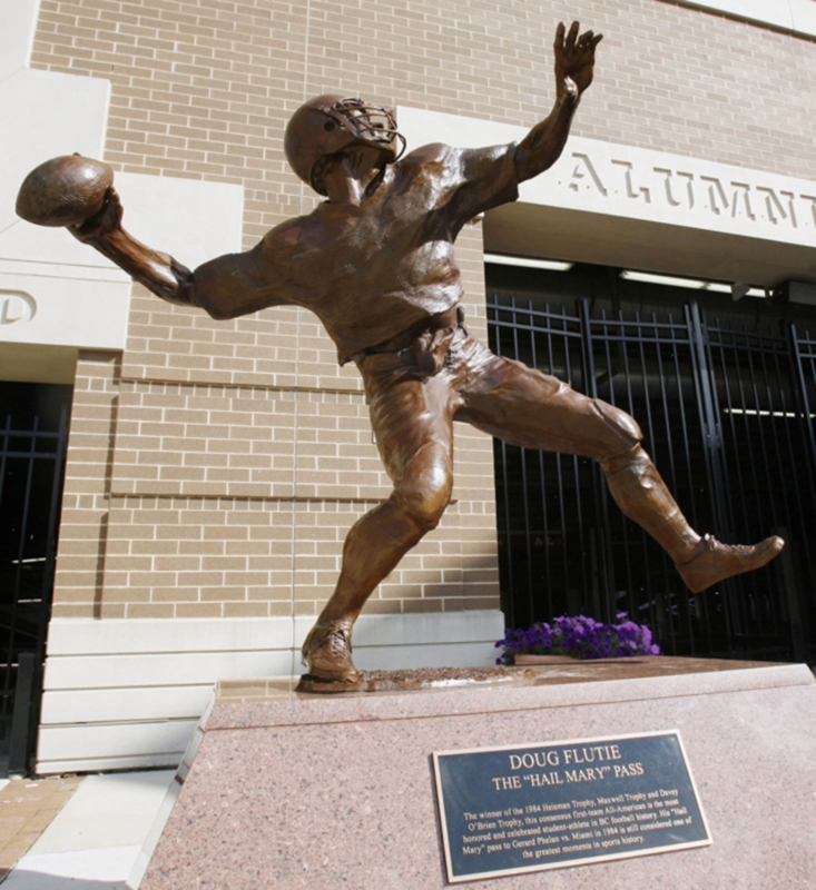 Dynamic Football Player Figure on Stone Plinth