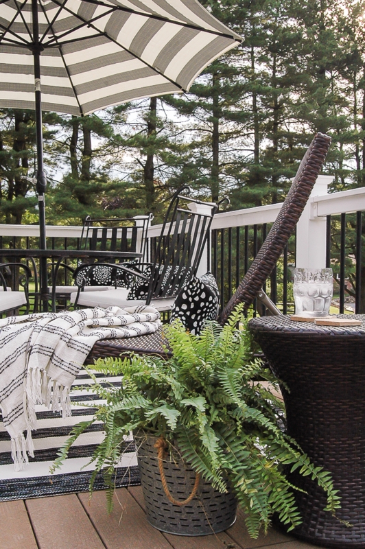 Farmhouse Black Adirondack Chairs paired with a Geometric Rug