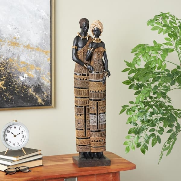 Figurine: Resin Black and Gold Contrast with Elongated Silhouette.