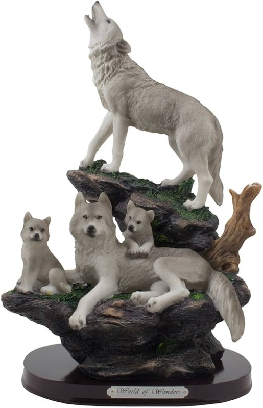 Figurine with wolf family motif in howling pose on a craggy pedestal.