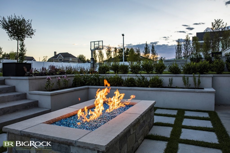 Fire Pit Round Stone Paver Design with Integrated Stone Bench.
