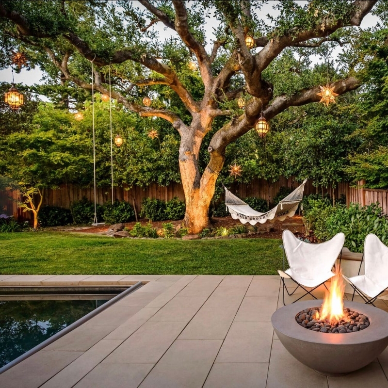Fire Pit Set with Adirondack Chairs on a Circular Gravel Pad