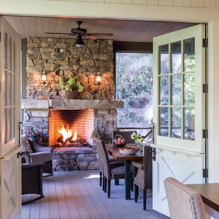 Floor-to-Ceiling Stone Fireplace in Lodge-Style Living Room with Vaulted Ceiling