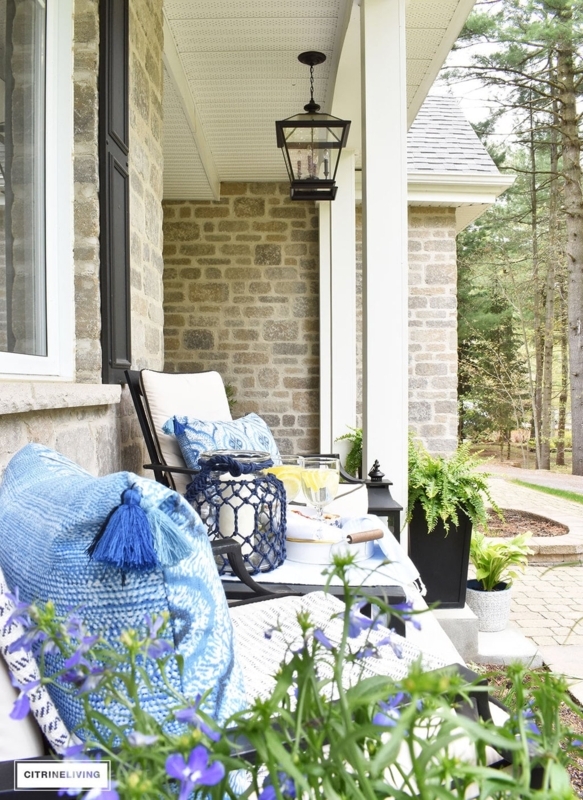 Front Porch Entryway Navy Door with Stacked Stone Texture and Lantern