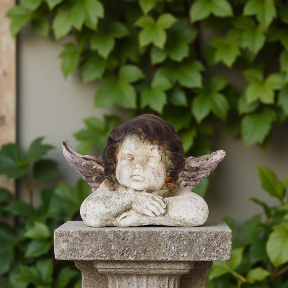 Garden Statue Weathered Stone Cherub Resting Pose Pitted Texture