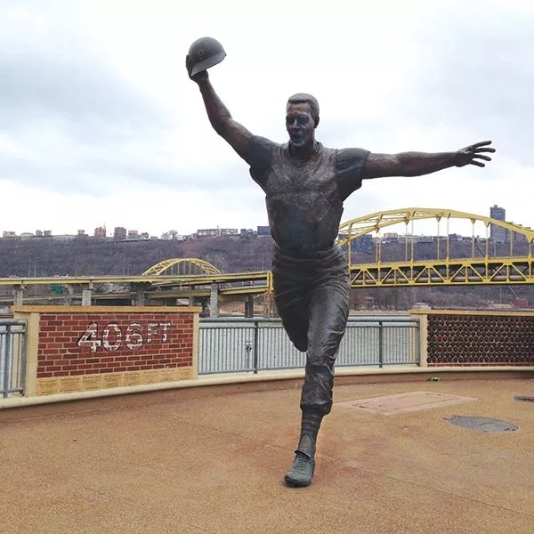 Large Bronze Athletic Statue in Batting Pose at Stadium