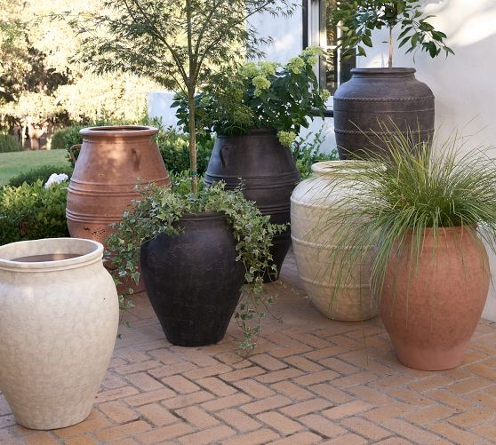 Large Tapered Outdoor Planter with Pitted Sienna Texture, Rustic Style.