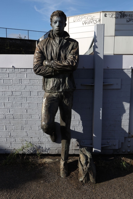 Life-Size Bronze Statue with Seated Figure and Integrated Bench.