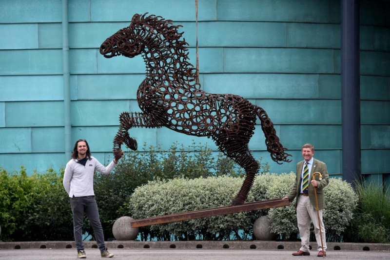 Life-Sized Horseshoe Sculpture with Layered Texture from Recycled Metal