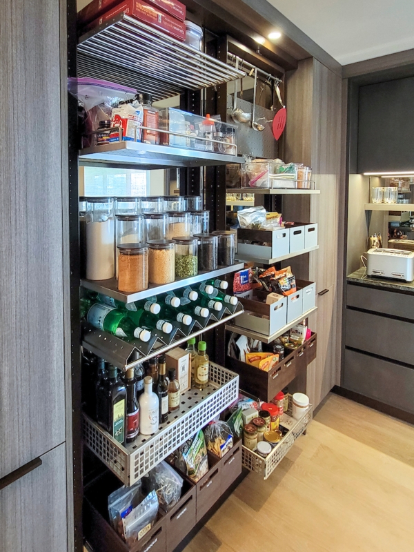 Luxury Pantry Cabinetry with Stone Textured Back Panel