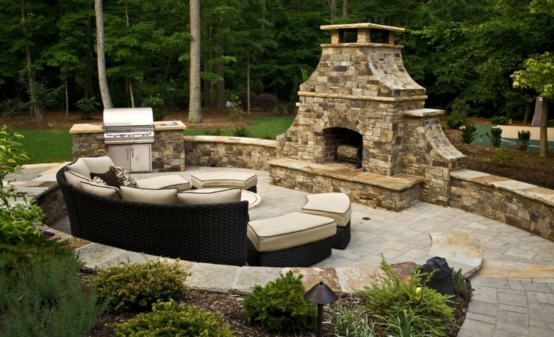 Masonry Outdoor Fireplace with Arched Opening and Built-In Grill