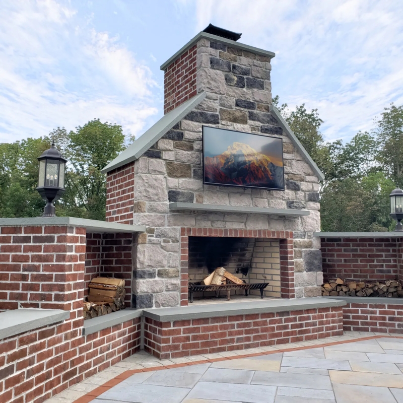 Masonry Outdoor Fireplace with Arched Opening and Chimney Stack