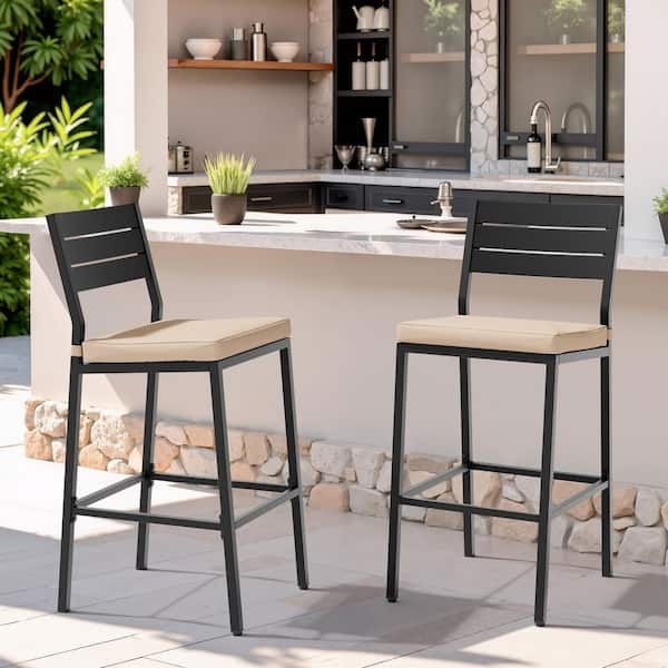 Metal Outdoor Bar Stools with Slatted Backs, Arms, and Beige Cushions