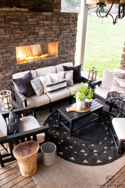 Metal Outdoor Sectional with a Geometric Rug on a Deck