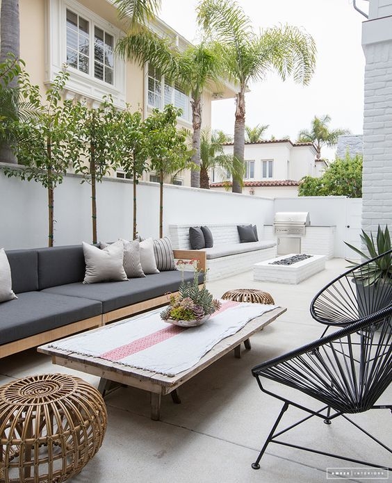 Minimalist Low-Profile Sectional Sofa with Circular Stone Table