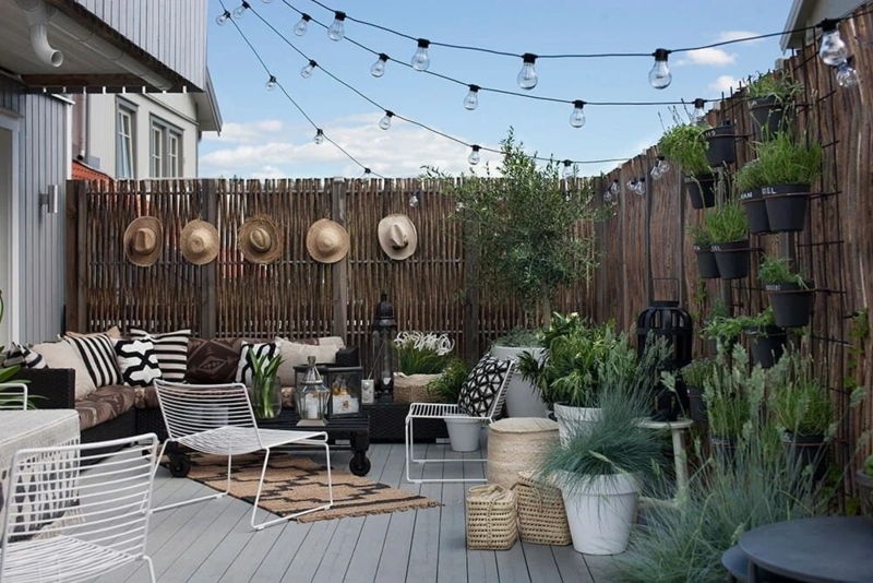 Modern Bohemian Patio Furniture Layout with Woven Lounge Chairs