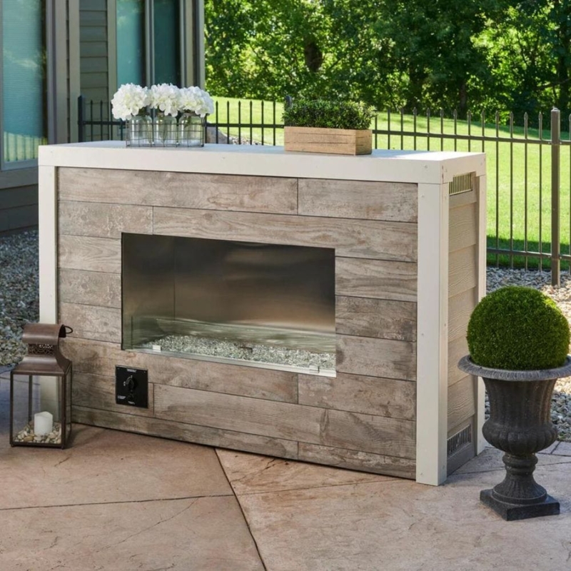 Modern Linear Outdoor Fireplace with Glass Wind Guard and Stone Cladding