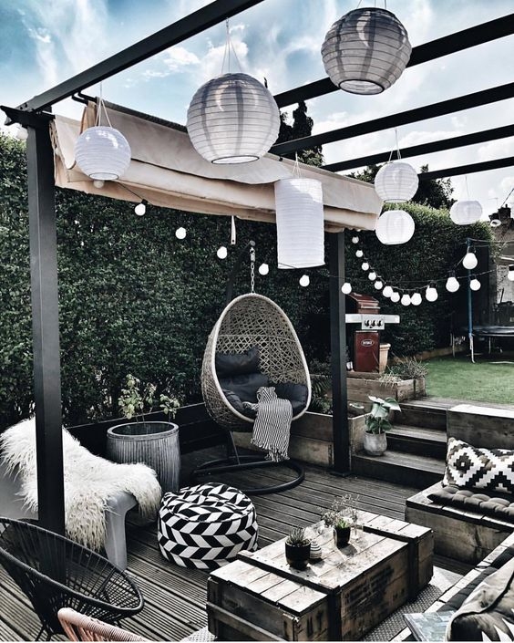 Modern Outdoor Sectional Lounge with Fire Bowl and Striped Club Chairs