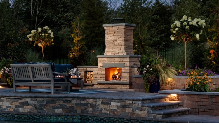 Modern Rustic Outdoor Fireplace with Integrated Wood Storage Nooks