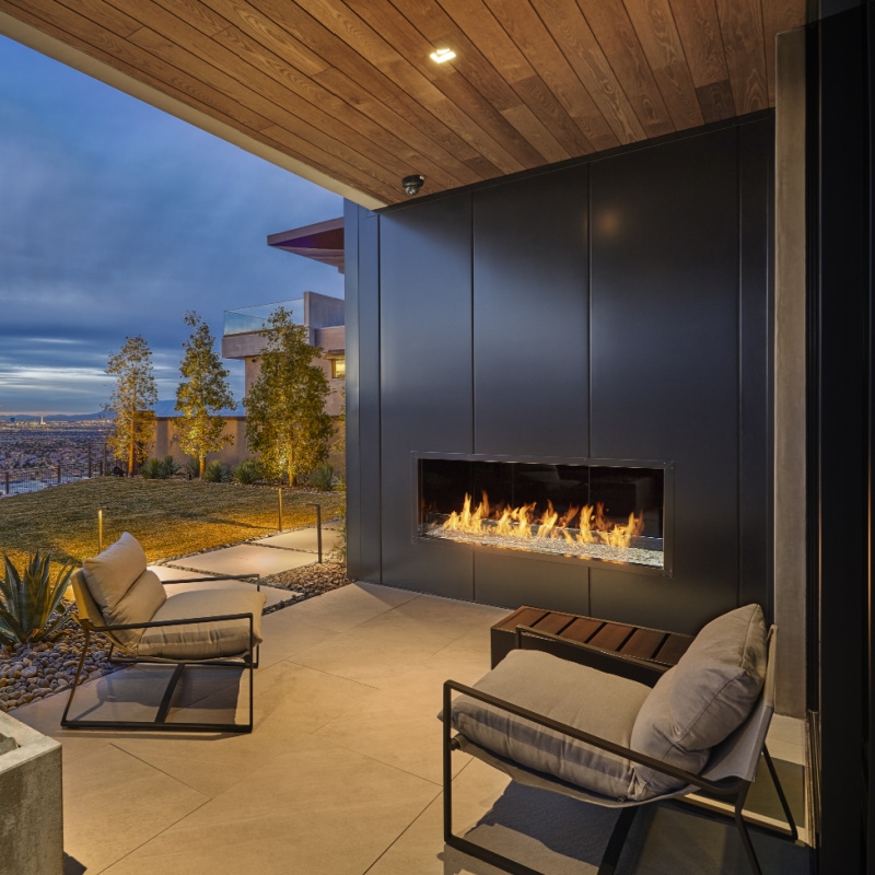 Modern Wide Linear Outdoor Fireplace Integrated in Stacked Stone