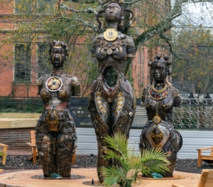 Monument: Weathered Bronze Patina with Sculptural Relief Design.