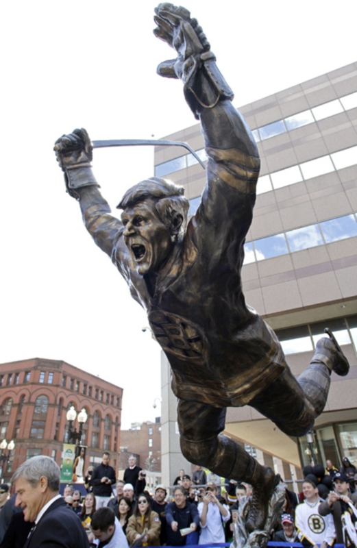 Monumental Bronze Statue in Mid-Air Hockey Pose on Pedestal