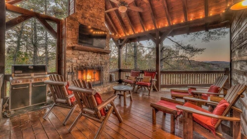 Natural Wood Log Bed Frame in Rustic Lodge Bedroom with Sloped Ceiling