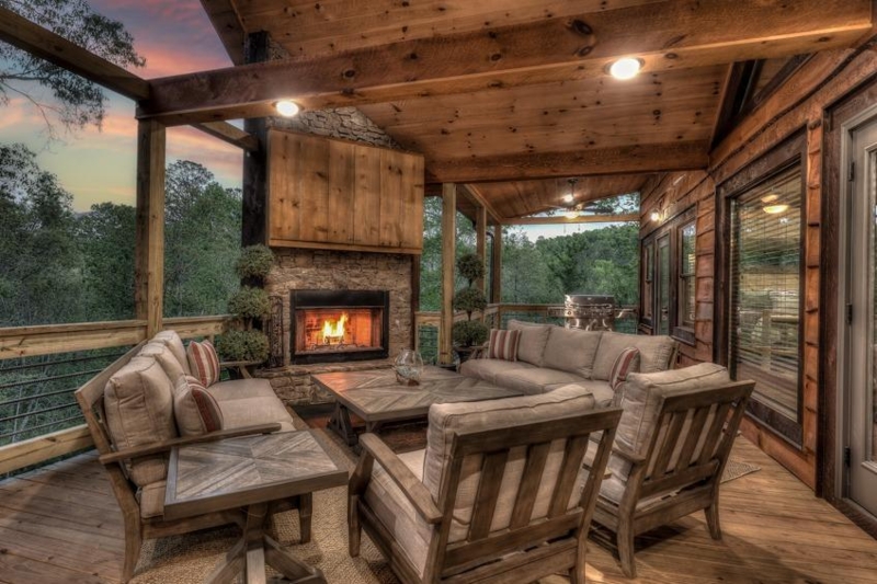 Open Concept Great Room with Floor-to-Ceiling Stone Fireplace and Timber Beams