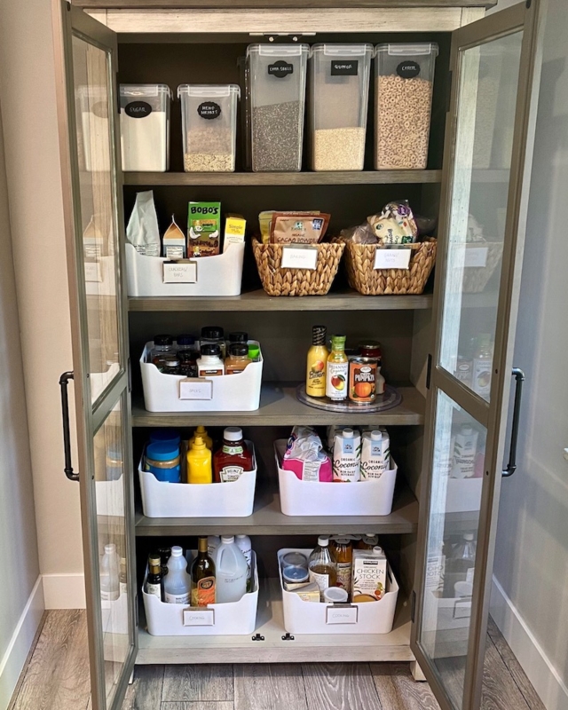 Organized Pantry Shelving System with Tiered Risers and Baskets