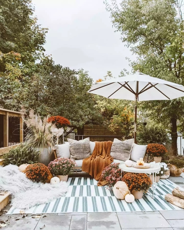 Outdoor Bench on a Log Home Porch with Seasonal Layering