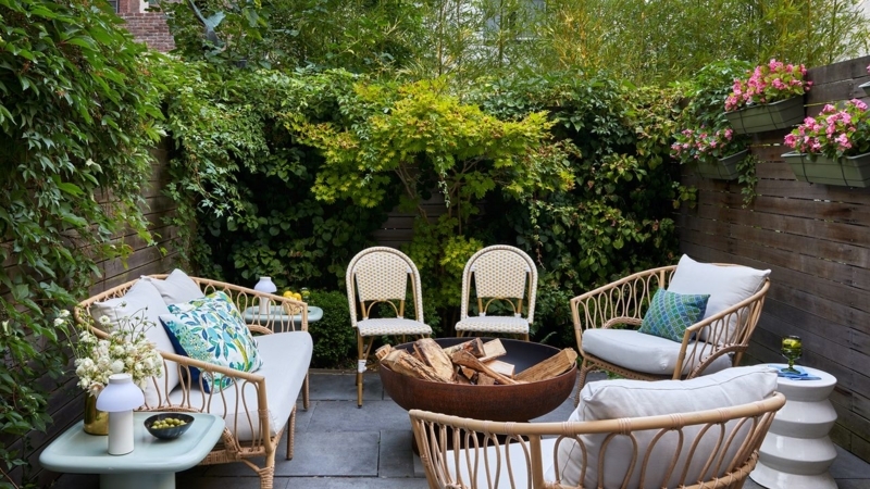 Outdoor Bistro Set with Teal Blue Cushions against White Brick Backdrop