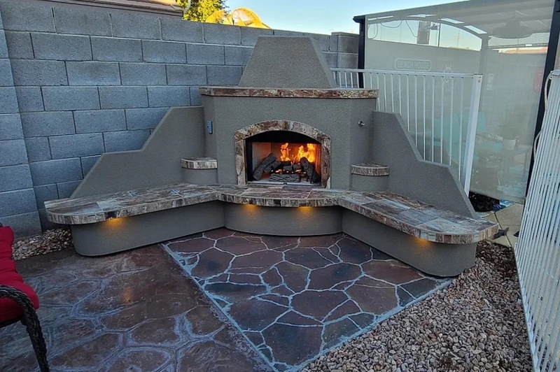 Outdoor Fireplace Corner Design with Stacked Stone and Wide Tiled Hearth