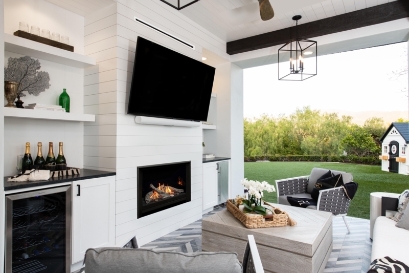 Outdoor Fireplace Integrated Log Storage, Stacked Stone. Rustic Coastal.