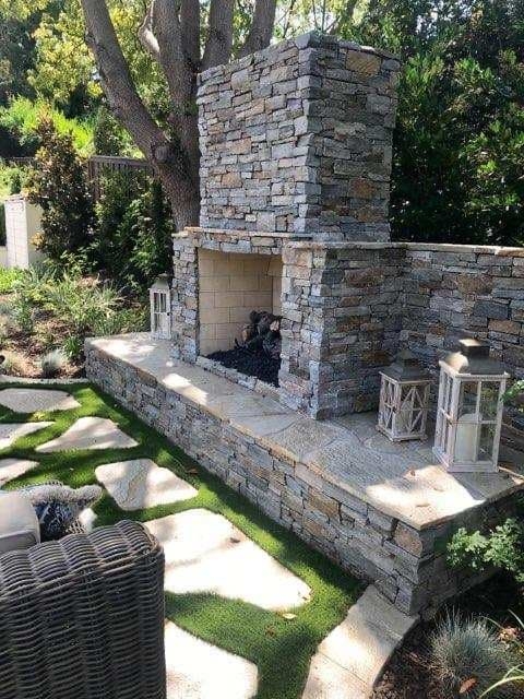 Outdoor Fireplace Stacked Stone Veneer with Raised Hearth for Covered Deck