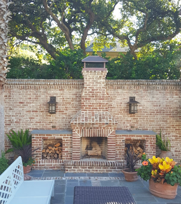 Outdoor Fireplace White Stone Cladding, Wood Beam Mantel. Transitional.