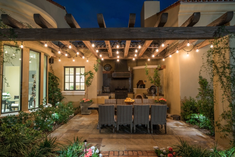 Outdoor Fireplace with Stacked Stone Facade and Integrated Seating