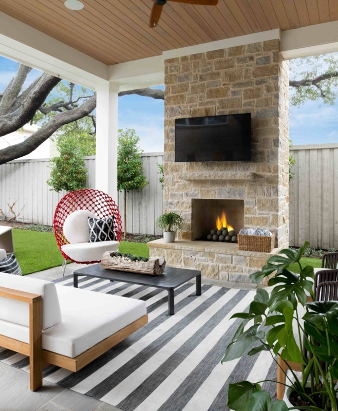 Outdoor Living Covered Outdoor Living Stacked Stone Fireplace. Rustic Patio.