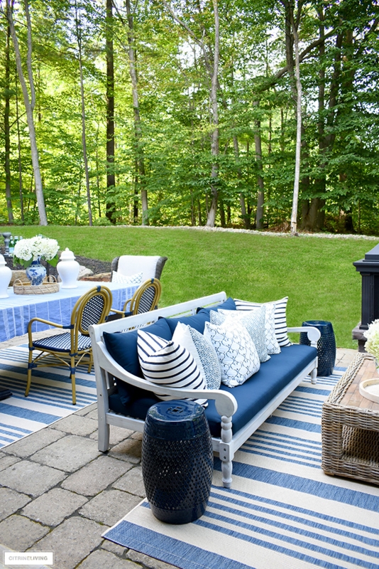 Outdoor Sectional Sofa L-Shaped with Block Print Pillows and Garden Stools