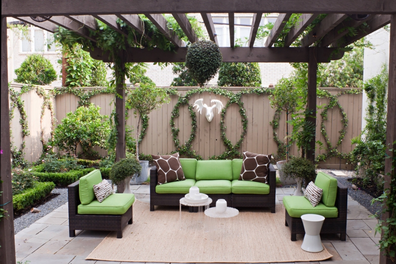 Outdoor Sectional Sofa on Deck featuring Stone Accent Wall