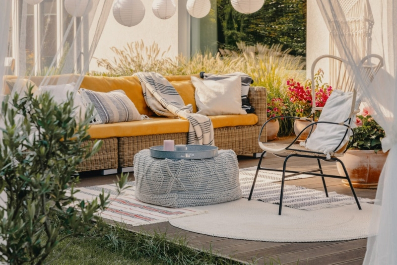 Outdoor Sofa Woven Wicker Frame Jute Pouf Table Neutral Cushions