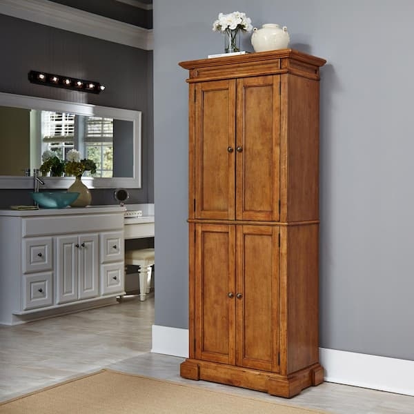 Pantry Cabinet Honey Oak Finish with Raised Panel Doors