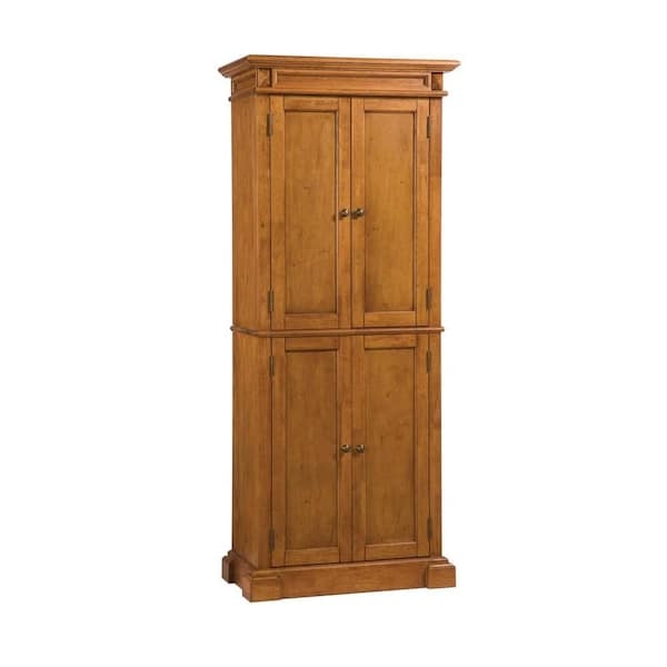 Pantry Cabinet in Distressed Oak with Four Doors and Bun Feet