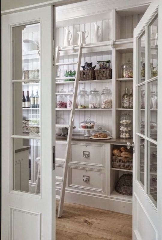 Pantry featuring Light Blue Cabinets and Brass Hardware Accents
