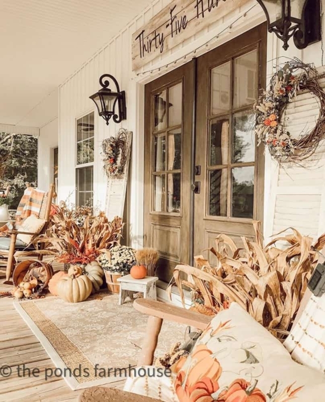 Porch Decor with Black Adirondack Chairs and Seasonal Color Contrast