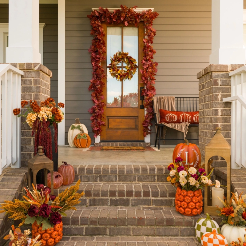 Porch Entryway featuring Layered Rug Styling and Black Accent Furniture