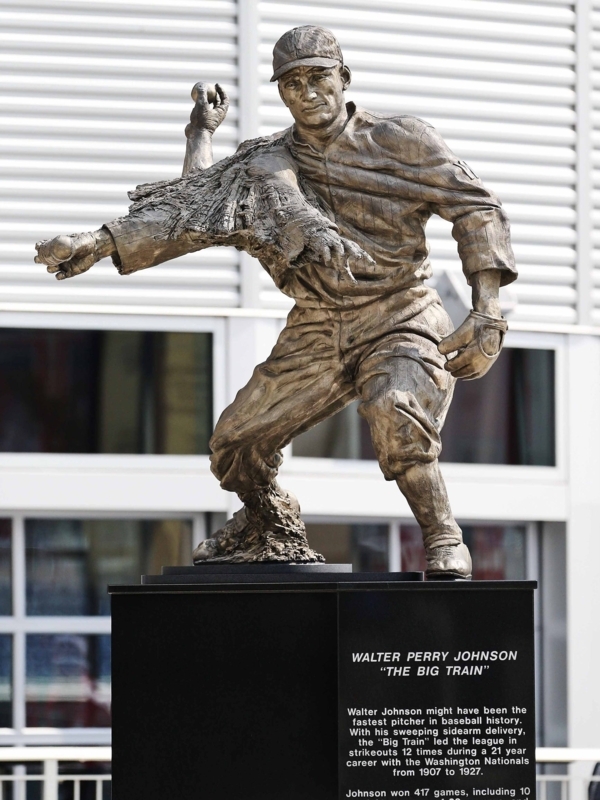Realistic Bronze Pitcher Statue in Mid-Motion on Granite Base