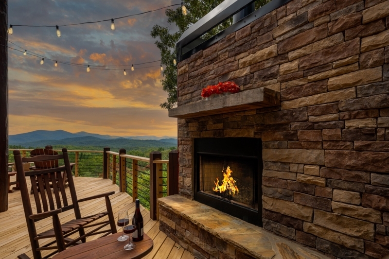 Rolled-Arm Leather-Like Sofa in Cabin Living Room with Stone Fireplace